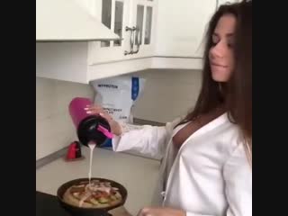 pretty woman dancing in the kitchen